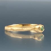 Side view of green diamond nugget facet ring.