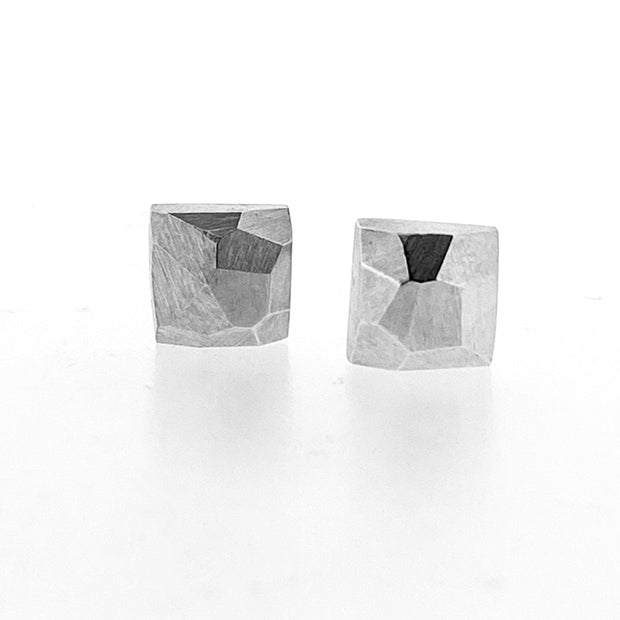 Full view of Square Faceted Stud Earrings. These earrings are in the shape of a square with a faceted texture on top of them.