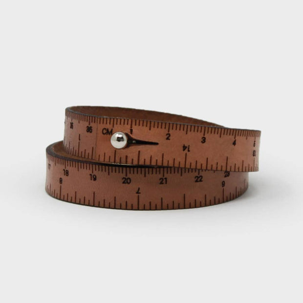 Full view of brown men's Leather Wrist Ruler with silver snap closing.