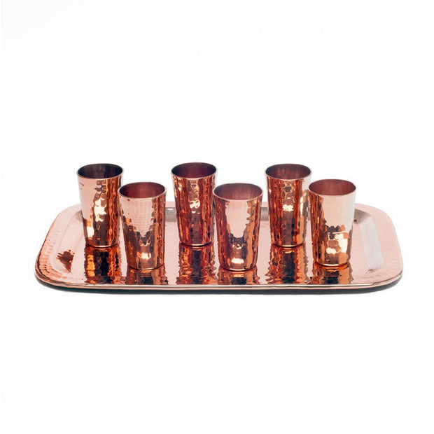 Full view of shot flight set. All made entirely of copper with hammered texture, six shot mugs sit on a copper tray.